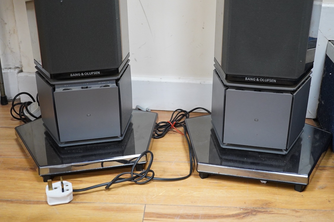 A Bang and Olufsen 6500 hi-fi system, comprising of a Beocord 6500, a Beogram CD 6500, a Beomaster 6500, and a master control panel, together with a pair of floor standing pedestal speakers, 164cm high, and pair of type
